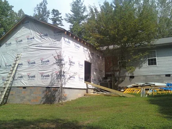 Tyvek wrapped gable on a new room addition beside an existing home in New Philadelphia